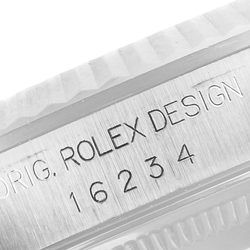 This image shows a close-up angle of the case side of a Rolex Datejust 16234 Men's Stainless Steel Mother of Pearl Dial 16234 Men's Stainless Steel Mother of Pearl Dial watch, displaying the model number and engraving.