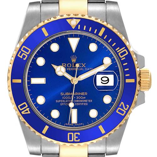 The image shows the face and bezel of a Rolex Submariner 116613 Men's Steel and Gold (two tone) Blue Dial 116613 Men's Steel and Gold (two tone) Blue Dial watch, highlighting its blue dial and date display.