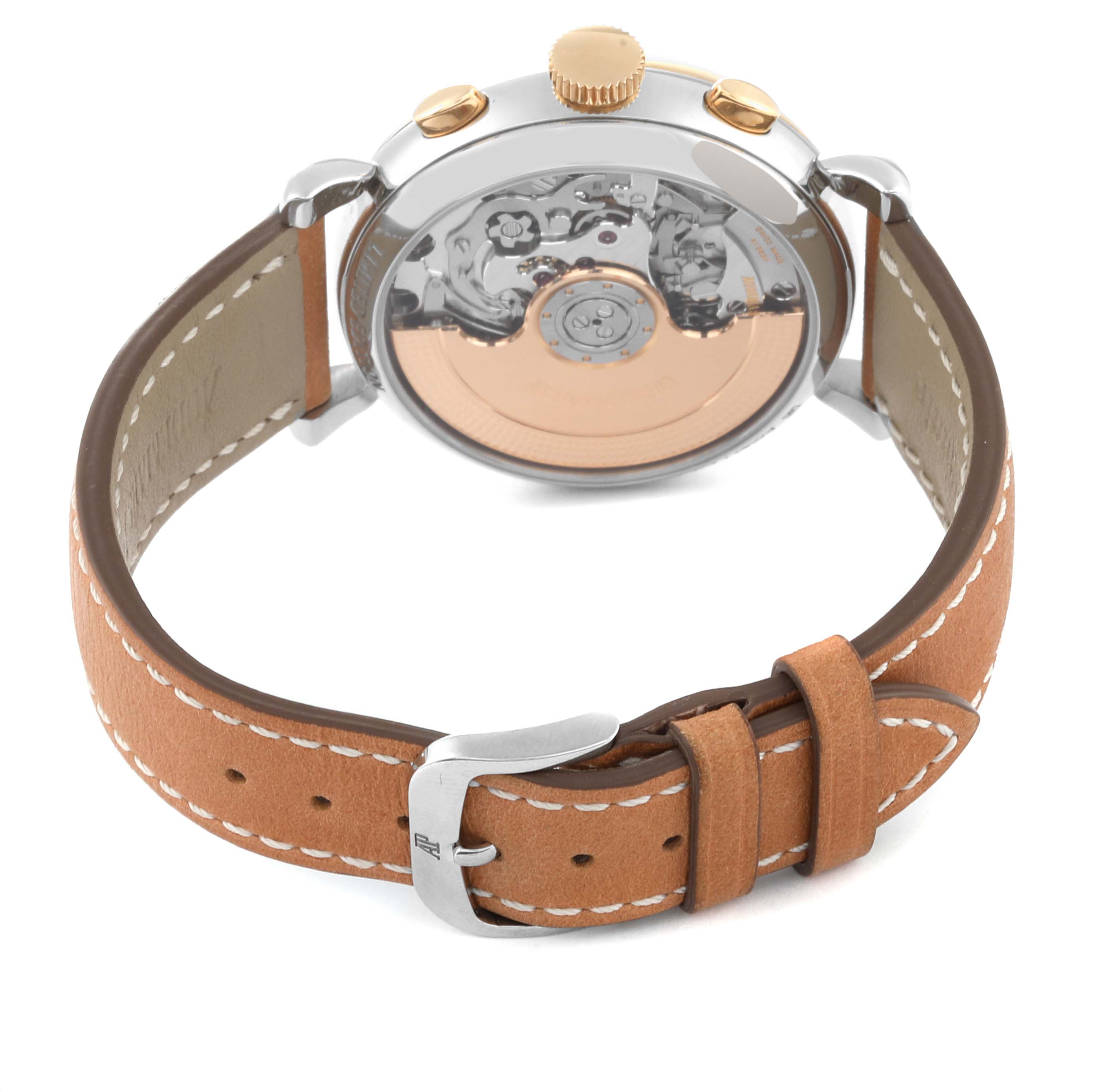 The image shows the back view of an Audemars Piguet Remaster  26595SR Men's Steel and Gold (two tone) Champagne Dial 26595SR Men's Steel and Gold (two tone) Champagne Dialwatch, highlighting its case back and movement, with a tan leather strap.