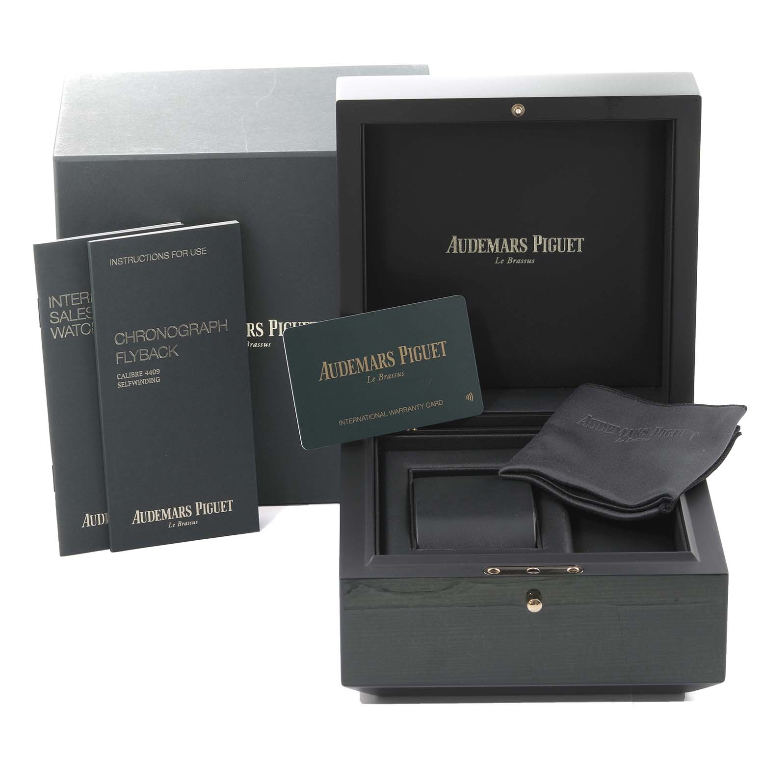 The image displays the packaging and accessories for the Audemars Piguet Remaster  26595SR Men's Steel and Gold (two tone) Champagne Dial 26595SR Men's Steel and Gold (two tone) Champagne Dialmodel, including the box, manuals, warranty card, and cloth.