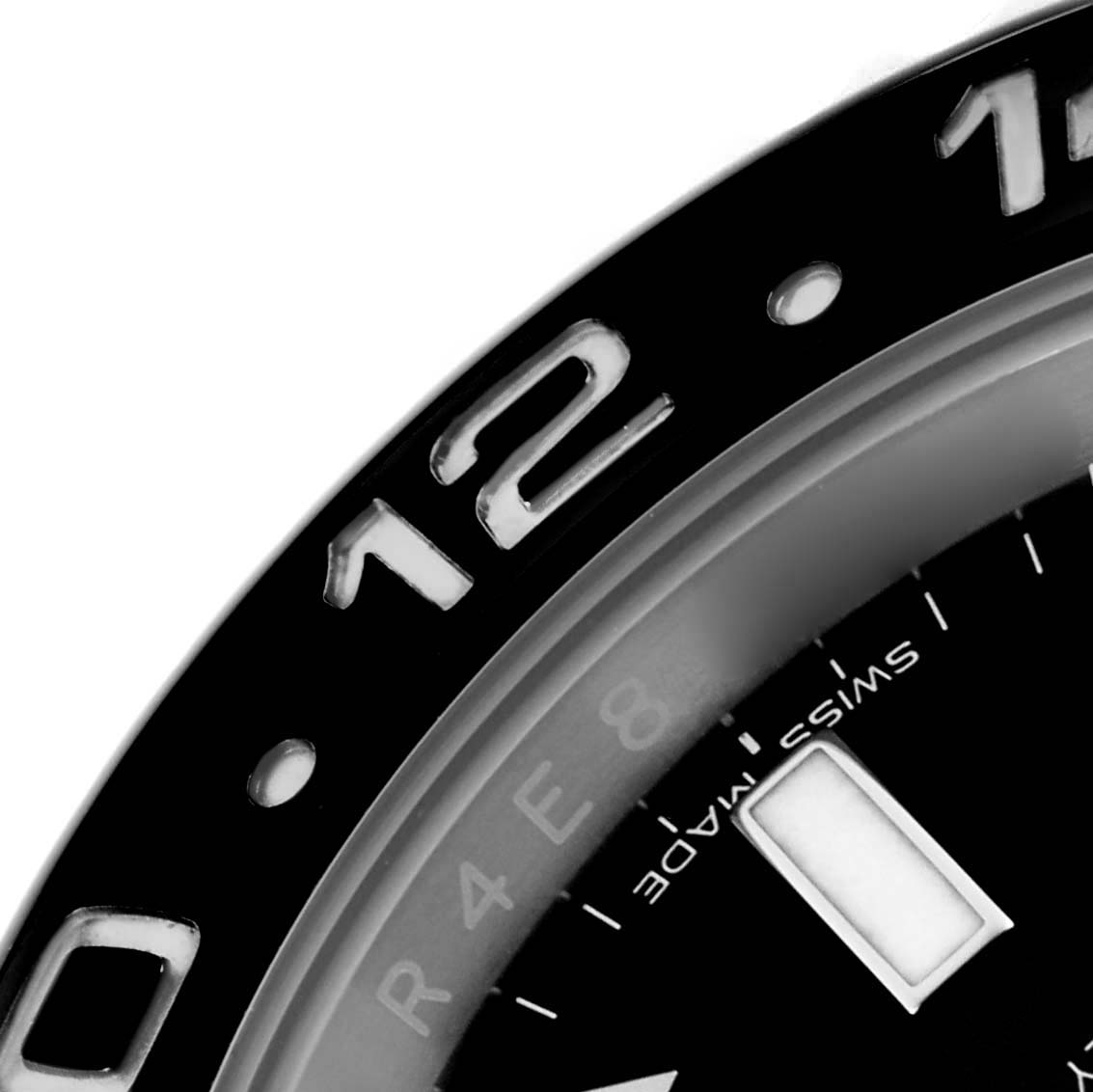 The image shows a close-up of the bezel and part of the dial of a Rolex GMT-Master 116710LN Men's Stainless Steel Black Dial 116710LN Men's Stainless Steel Black Dial.