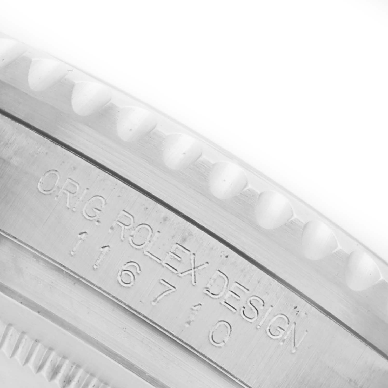 The image shows a close-up of the side engraving on the bezel of a Rolex GMT-Master 116710LN Men's Stainless Steel Black Dial 116710LN Men's Stainless Steel Black Dial, displaying the model number.