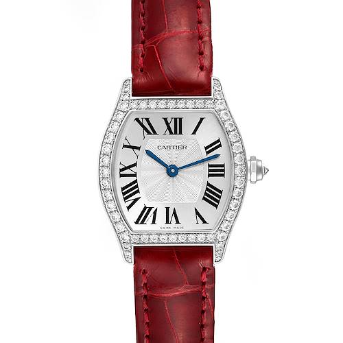 The image shows a front view of the Tortue model by Cartier, displaying the watch face, bezel, and red leather strap.