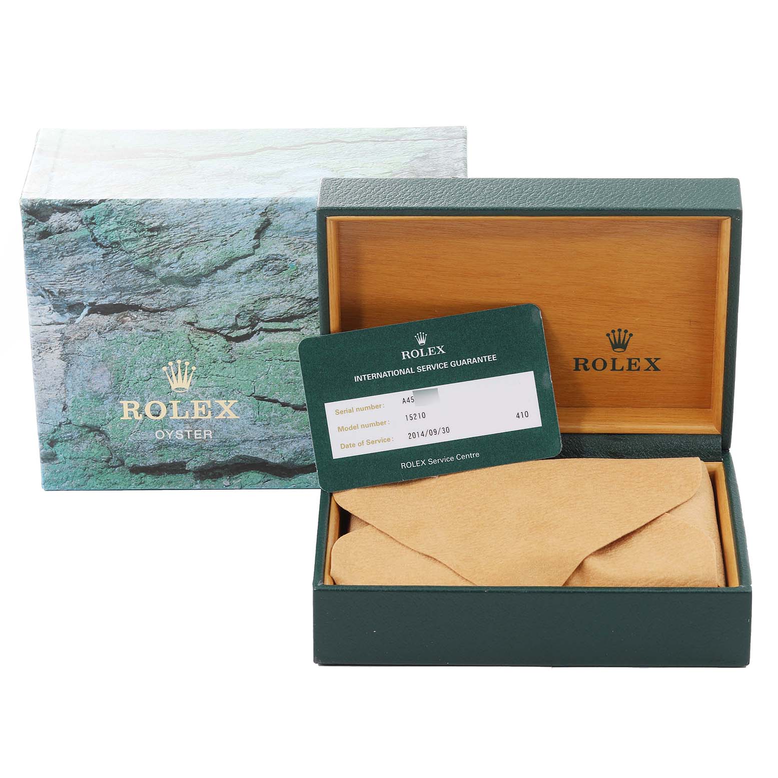 The image shows a Rolex Date 15210 Men's Stainless Steel Silver Dial 15210 Men's Stainless Steel Silver Dial model's packaging, including the box, a warranty card, and a wrapped item, likely the watch.