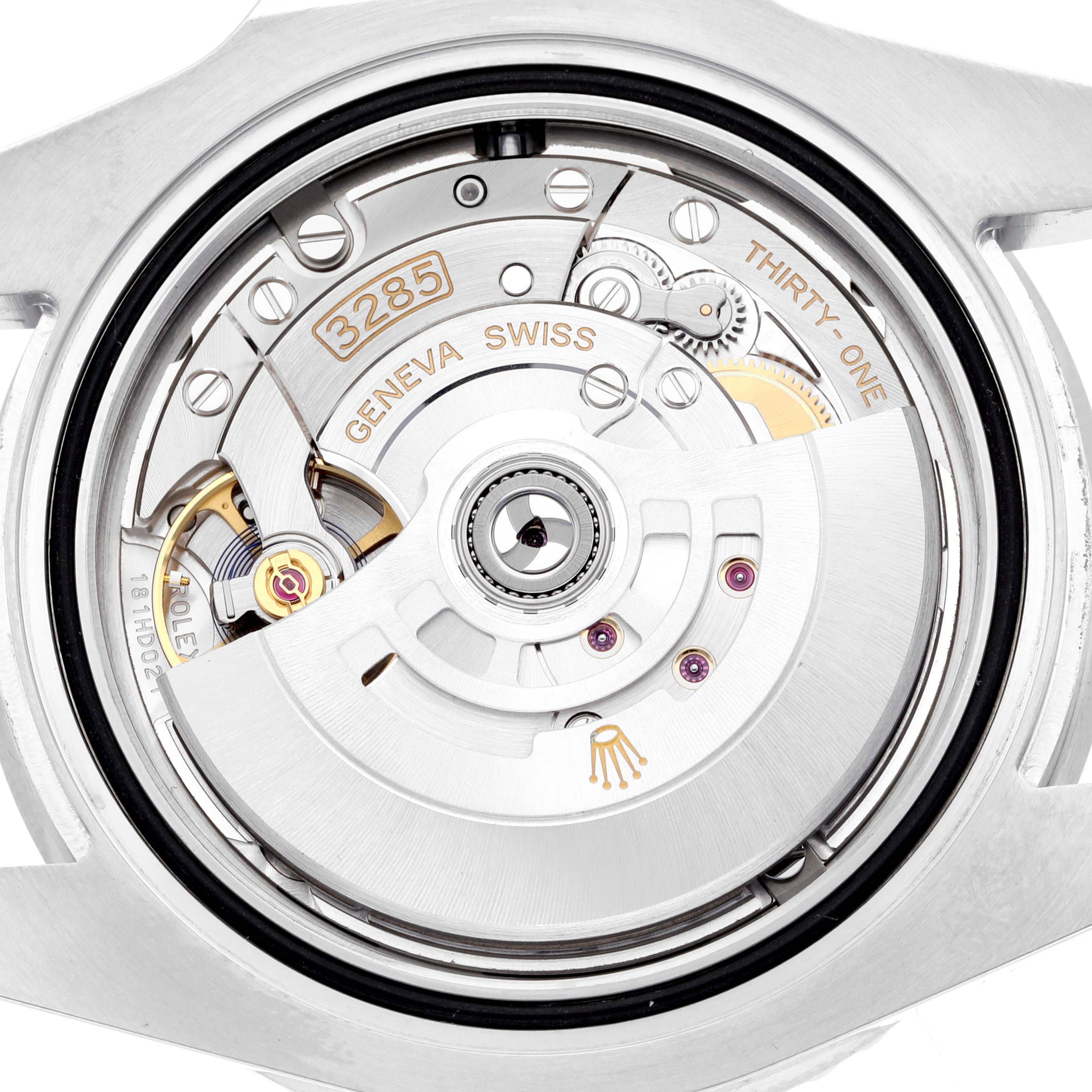 The image shows a close-up of the movement of a Rolex GMT-Master 126710BLNR Men's Stainless Steel Black Dial 126710BLNR Men's Stainless Steel Black Dial watch, highlighting its intricate internal mechanisms.