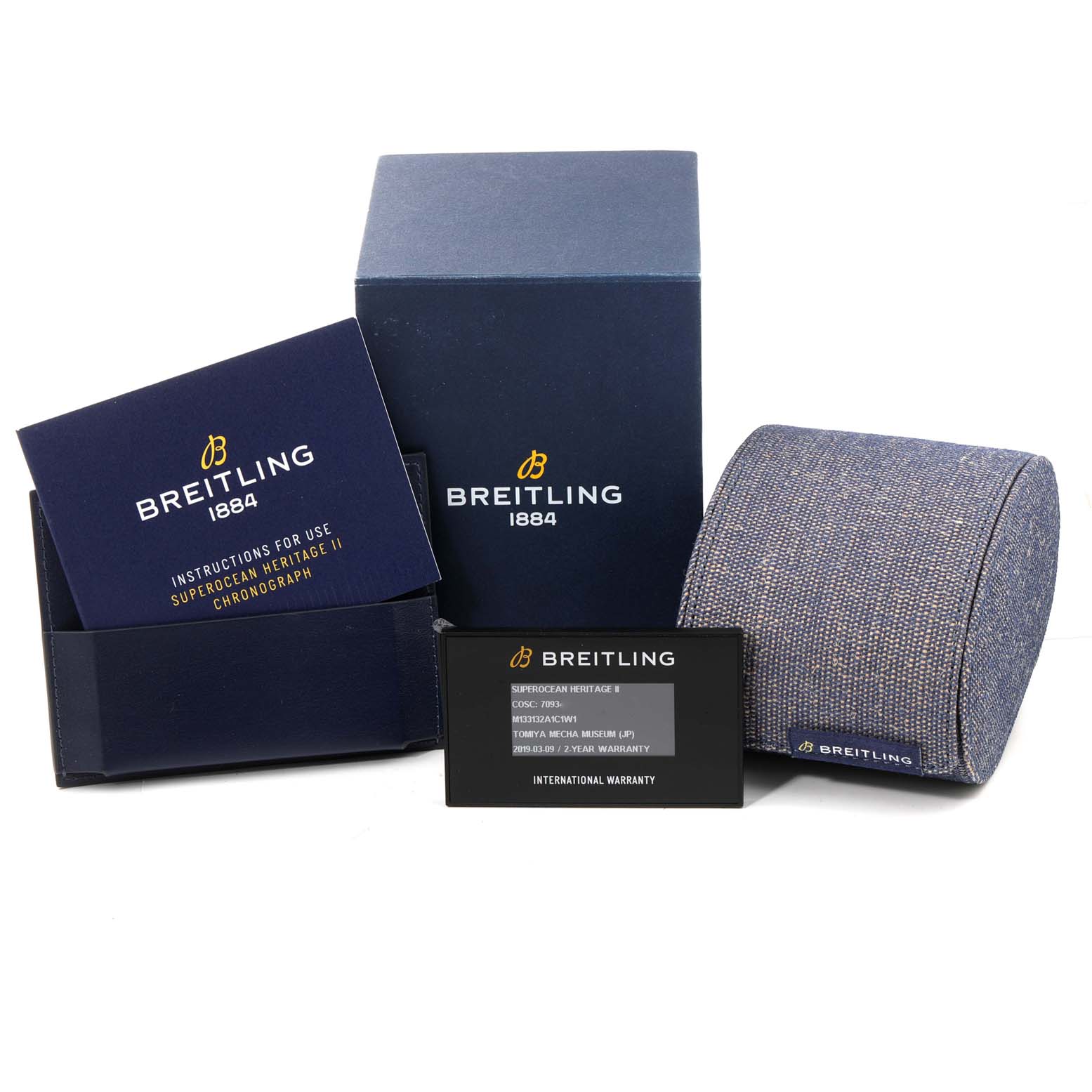 The image shows the box, instruction manual, international warranty card, and watch cushion for the Breitling Superocean M13313 Men's Stainless Steel Blue Dial M13313 Men's Stainless Steel Blue Dial model.