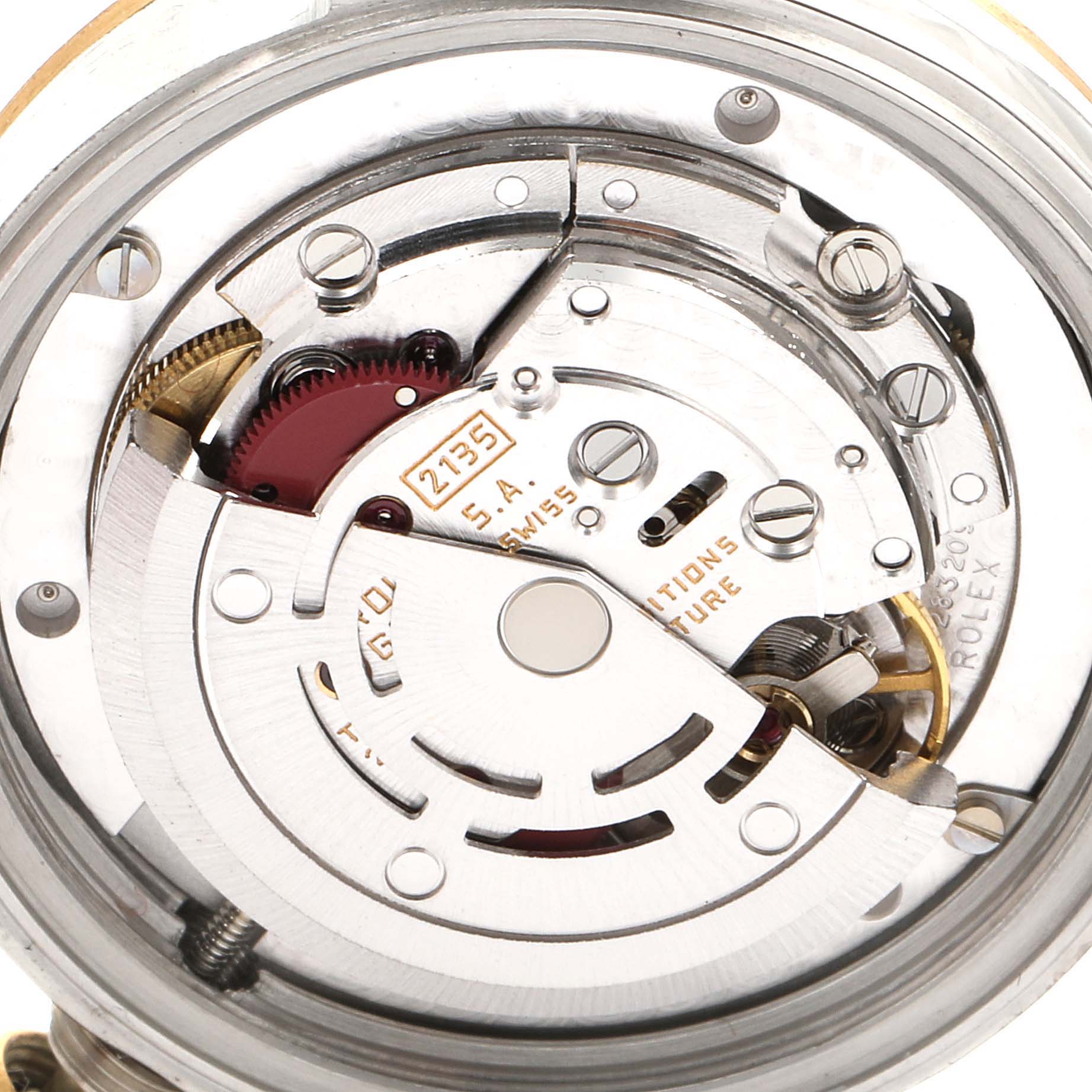 This is a close-up view of the internal mechanisms of a Rolex Mid-Size 68273 Women's Steel and Gold (two tone) Champagne Dial 68273 Women's Steel and Gold (two tone) Champagne Dial model watch, showcasing its intricate movement parts.