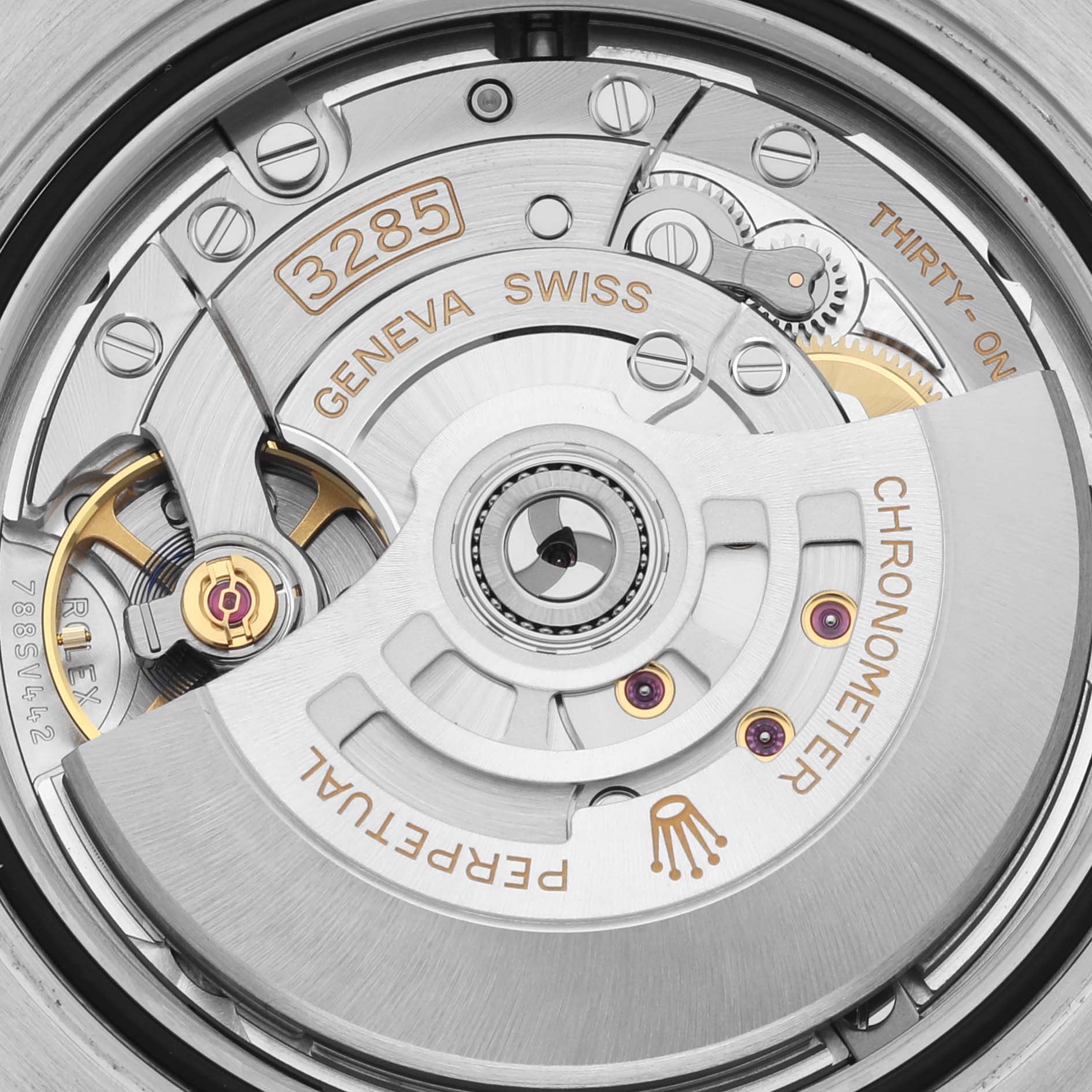 The image shows a close-up of the movement of a Rolex GMT-Master 68251 Men's Stainless Steel Black Dial 68251 Men's Stainless Steel Black Dial watch, highlighting the rotor and gears.