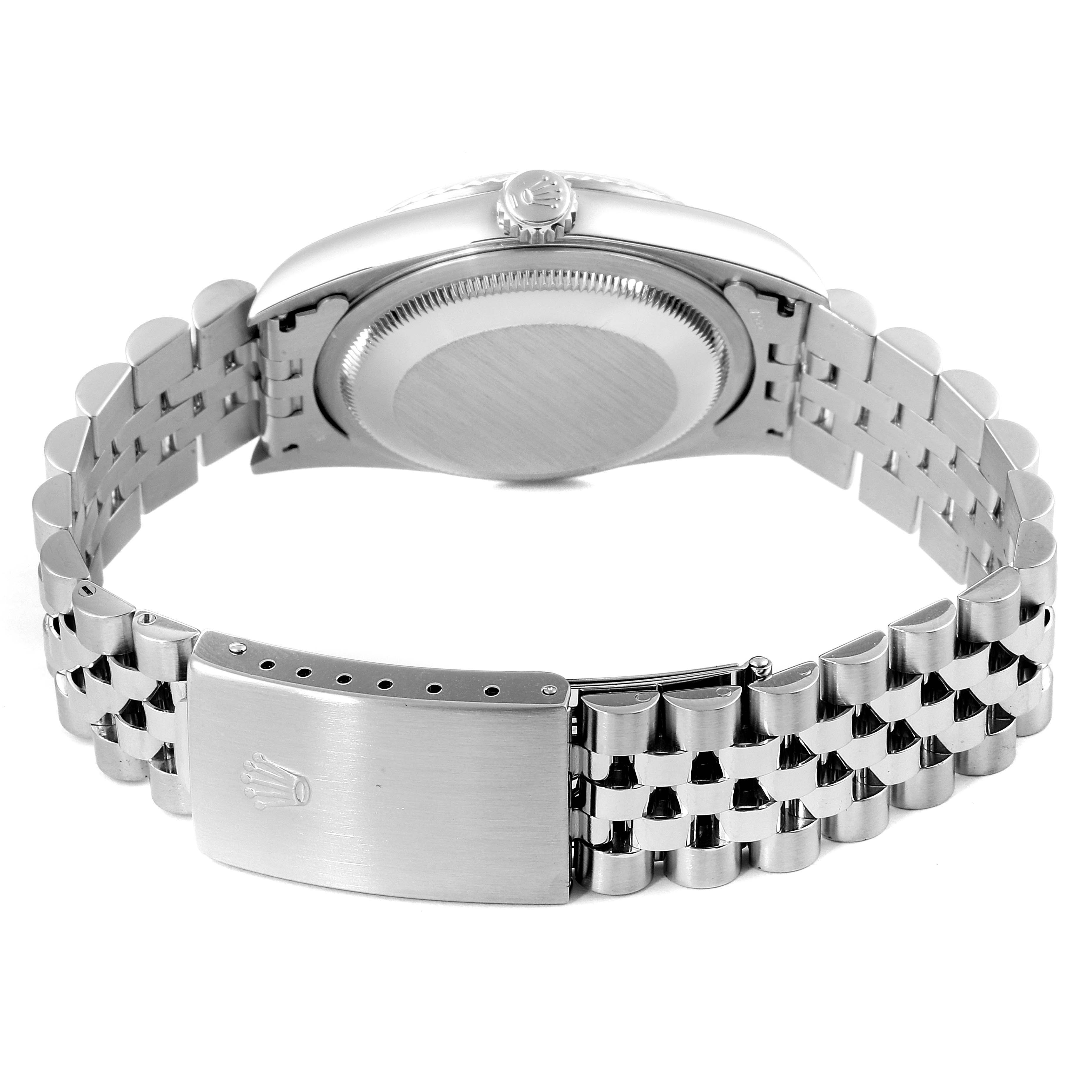 The image shows the back view of the Rolex Datejust 16234 Men's Stainless Steel Silver Dial 16234 Men's Stainless Steel Silver Dial watch, including the crown, case back, and clasp of the metal bracelet.