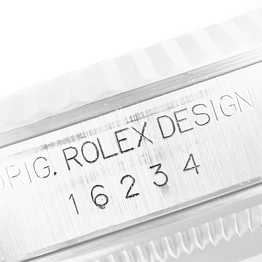 The image shows a close-up of the case engraving on a Rolex Datejust 16234 Men's Stainless Steel Silver Dial 16234 Men's Stainless Steel Silver Dial model, including the model number "16234" and "Rolex Design."