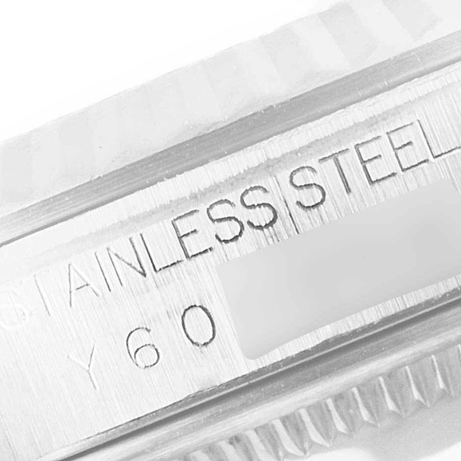 This image shows a close-up of the case side of a Rolex Datejust 16234 Men's Stainless Steel Silver Dial 16234 Men's Stainless Steel Silver Dial watch, highlighting the "STAINLESS STEEL" engraving.