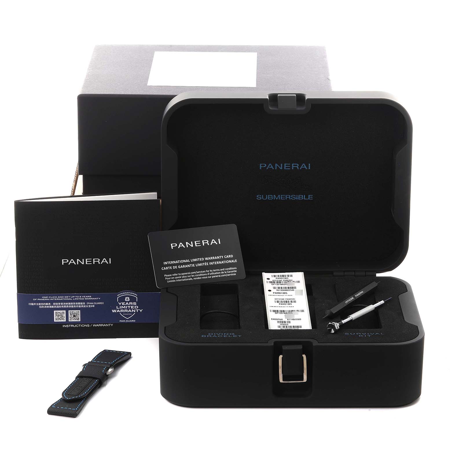The image shows a Panerai Luminor PAM01305 Men's Stainless Steel Black Dial PAM01305 Men's Stainless Steel Black Dial watch case with tools, a warranty card, a booklet, and an additional strap from a front angle.