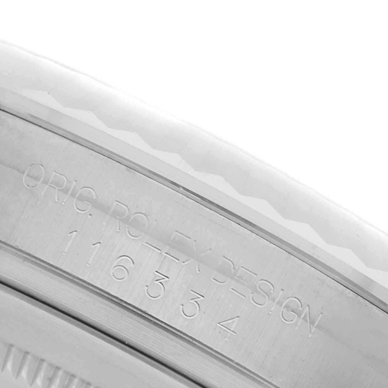 The image shows a close-up of the engraved case side of a Rolex Datejust 41 116334 Men's Stainless Steel Silver Dial 116334 Men's Stainless Steel Silver Dial.