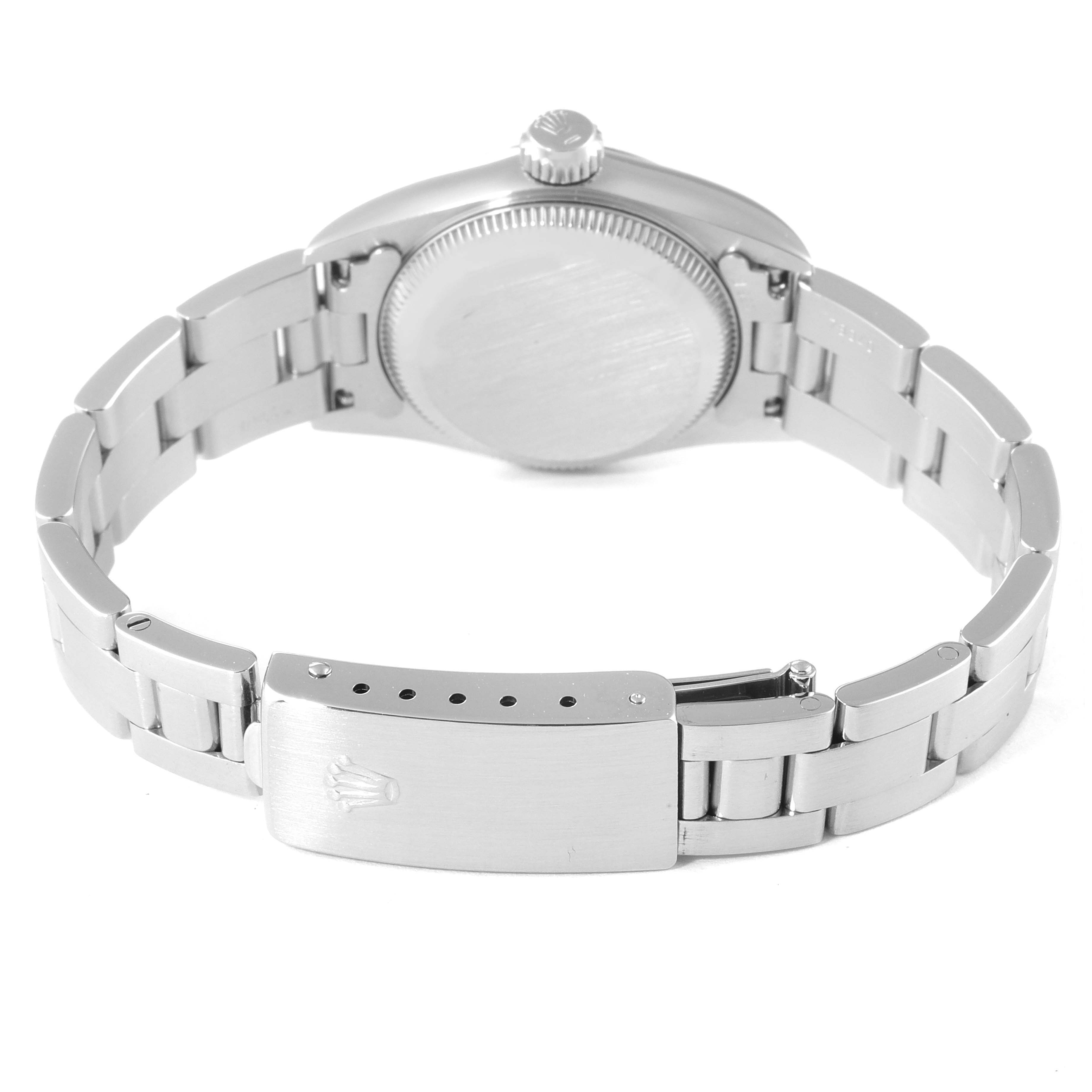 The image shows the back view of a Rolex Oyster Perpetual 67180 Women's Stainless Steel White Dial 67180 Women's Stainless Steel White Dial watch, focusing on the case back and the clasp of the bracelet.