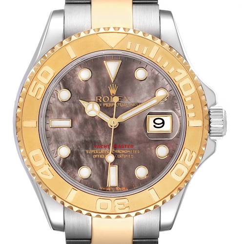 The Rolex Yacht-Master model 16623 is shown from the front, highlighting its mother-of-pearl dial, date window, and gold bezel, with the crown partially visible.