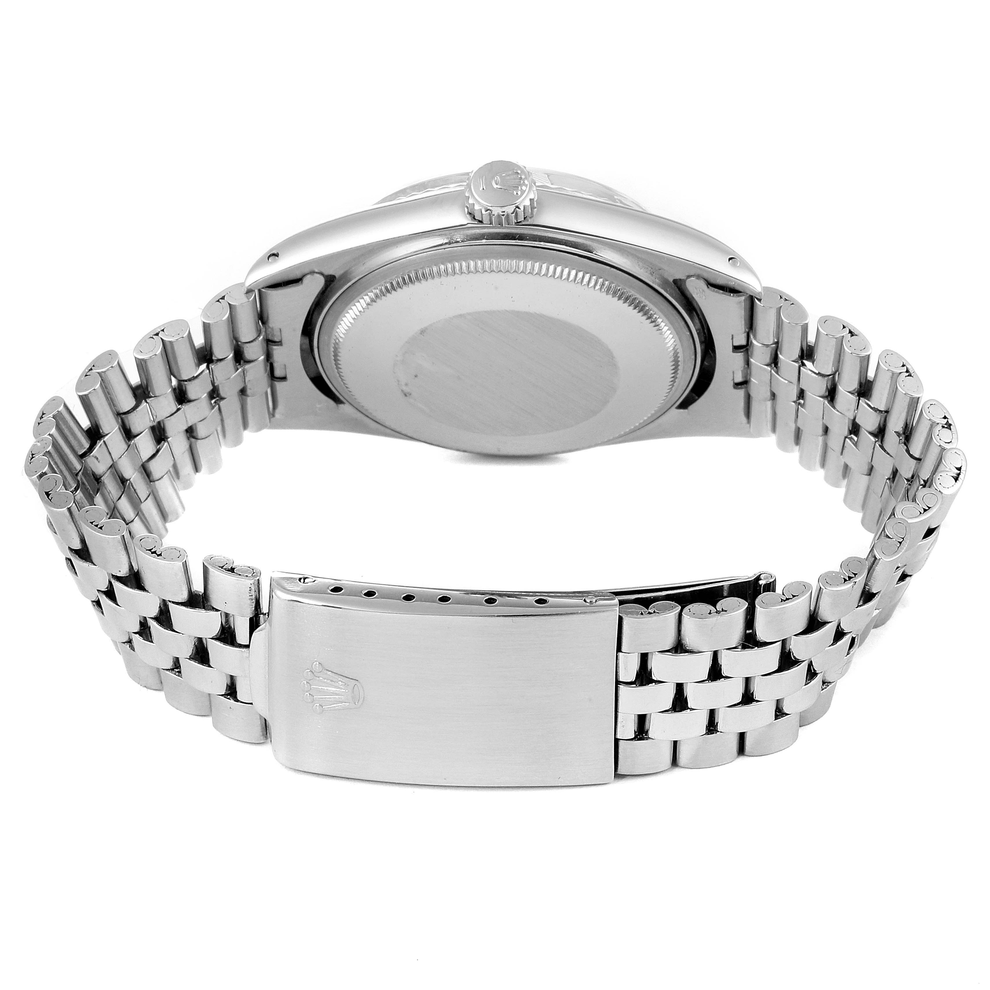 This image shows the back case, crown, and bracelet clasp of a Rolex Vintage Collection 1601 Men's Stainless Steel Silver Dial 1601 Men's Stainless Steel Silver Dial model watch.