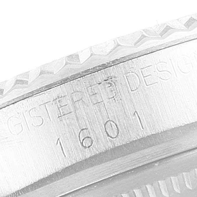 This image shows a close-up of the bezel and case of a Vintage Collection Rolex model 1601.