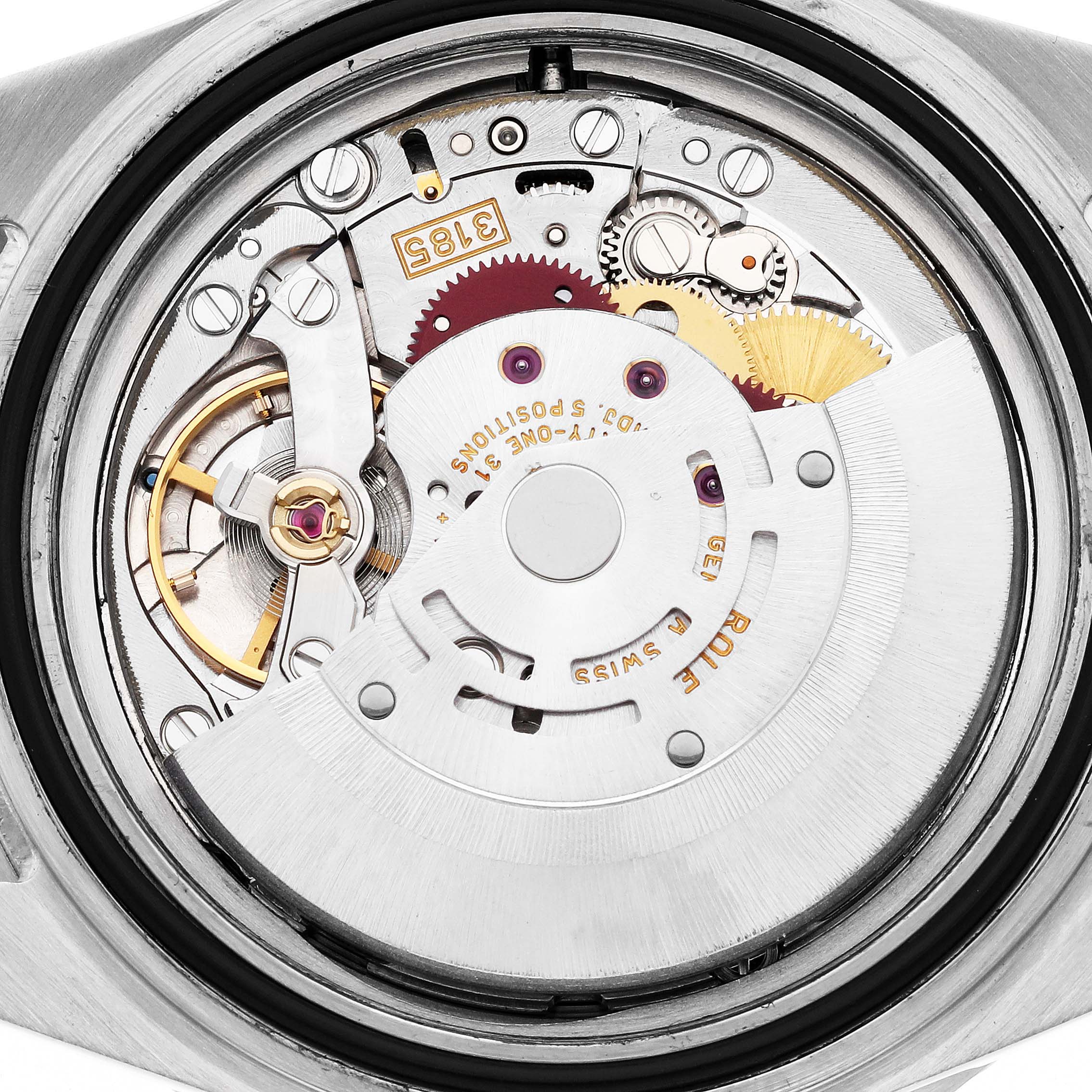 The image shows the movement of a Rolex GMT-Master 16710 Men's Stainless Steel Black Dial 16710 Men's Stainless Steel Black Dial watch from a rear angle, highlighting gears and the oscillating weight.