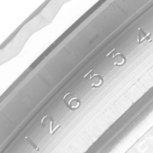 The image shows a partial side view of the bezel and fluted detailing of a Rolex Datejust 41 126334 Men's Stainless Steel Silver Dial 126334 Men's Stainless Steel Silver Dial watch.