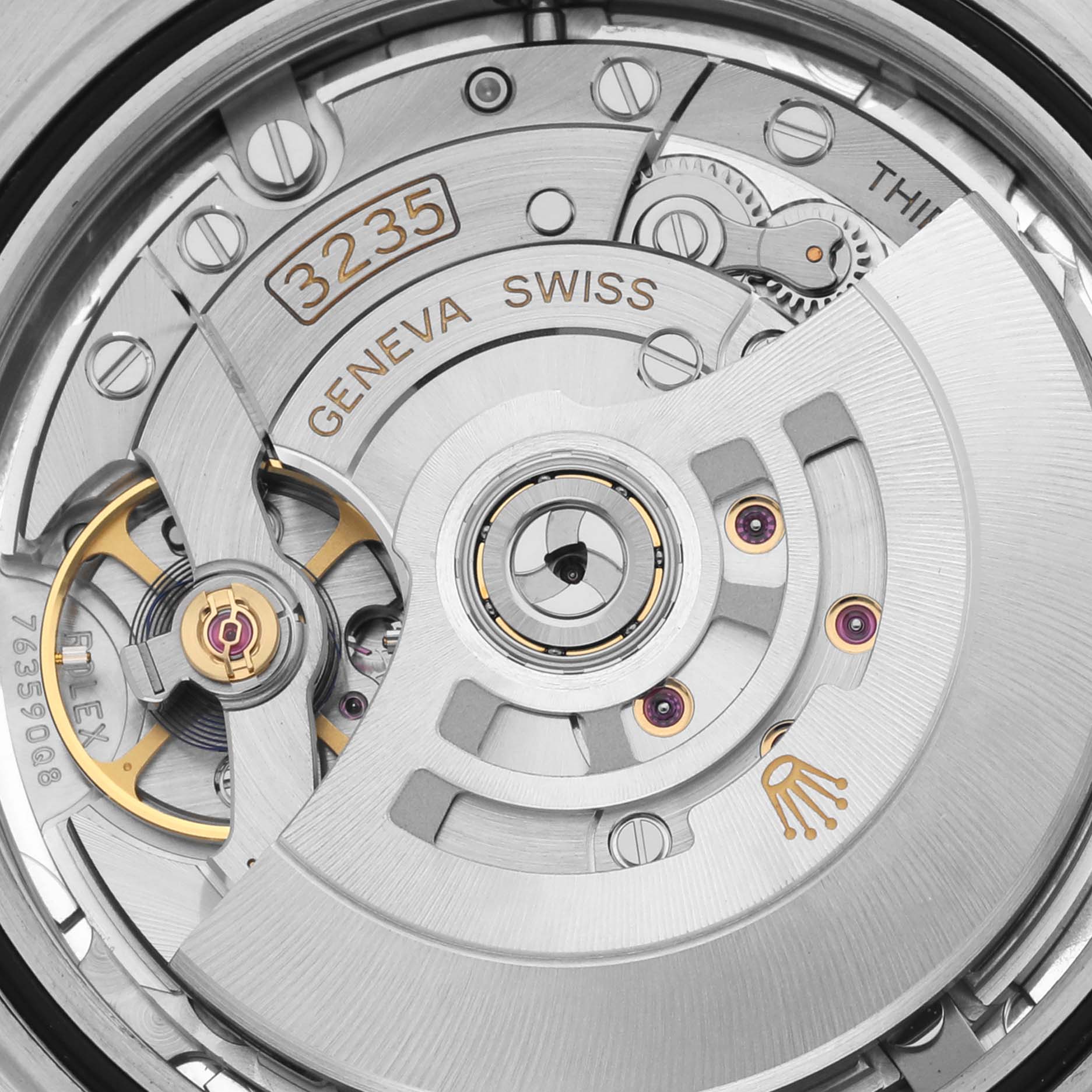 The image shows a close-up of the Rolex Datejust 41 126334 Men's Stainless Steel Silver Dial 126334 Men's Stainless Steel Silver Dial's movement, highlighting its intricate gears and rotor.