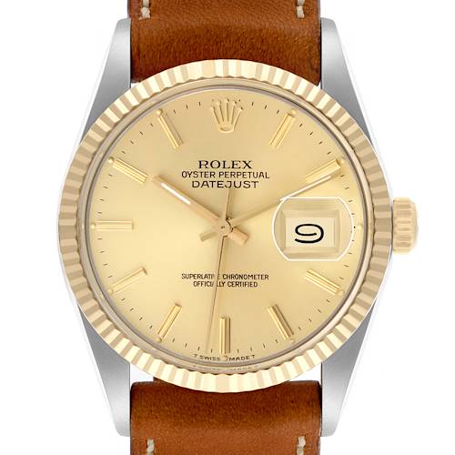 The Rolex Datejust 16013 Men's Steel and Gold (two tone) Champagne Dial 16013 Men's Steel and Gold (two tone) Champagne Dial watch is shown from a top-down angle, highlighting the dial, fluted bezel, and leather strap.