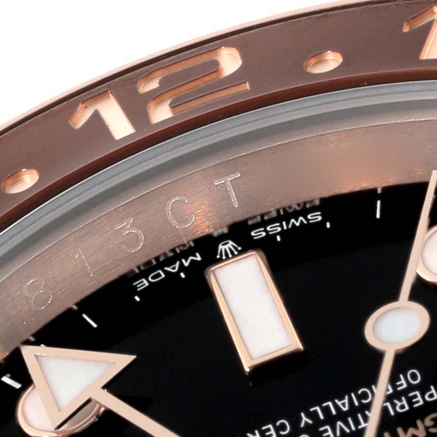 This close-up shows the bezel, part of the face, and hour markers of the Rolex GMT-Master 126715CHNR Men's Rose Gold Black Dial 126715CHNR Men's Rose Gold Black Dial watch.