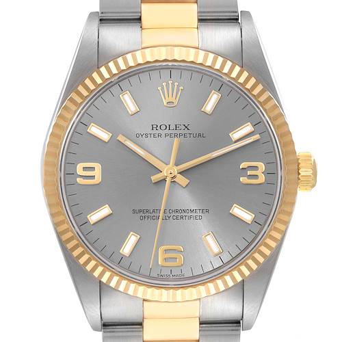 The image shows a front view of the Rolex Oyster Perpetual 14233 Men's Steel and Gold (two tone) Grey Dial 14233 Men's Steel and Gold (two tone) Grey Dial watch, highlighting its dial, bezel, hands, and part of the bracelet.