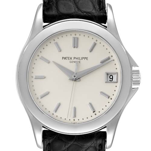 The image shows a front view of a Patek Philippe Calatrava 5107G Men's White Gold Silver Dial 5107G Men's White Gold Silver Dial watch, highlighting its dial, hands, date window, and leather strap.