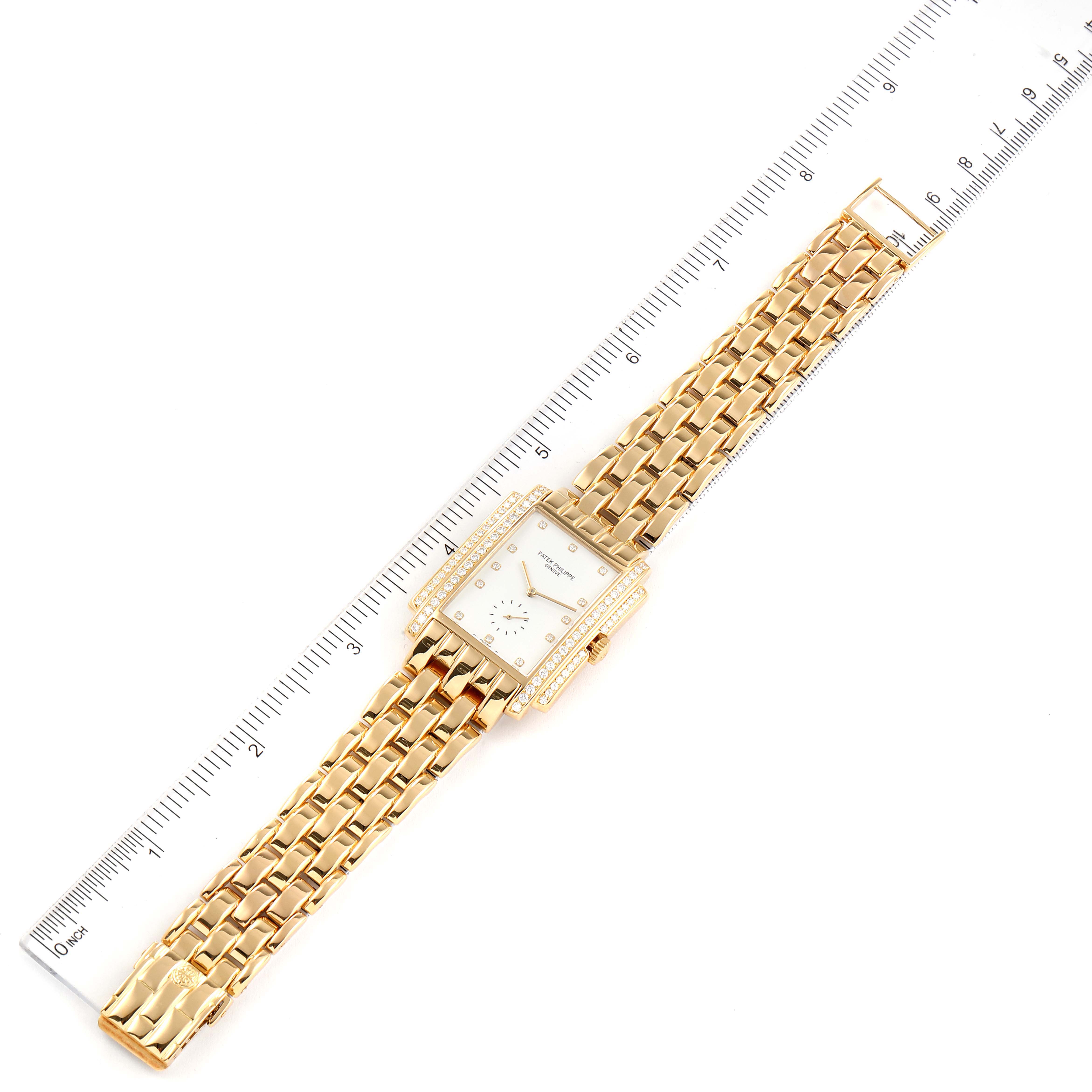 The image shows a Patek Philippe Gondolo 5025J Men's Yellow Gold White Dial 5025J Men's Yellow Gold White Dial watch lying flat with a ruler beside it for scale.