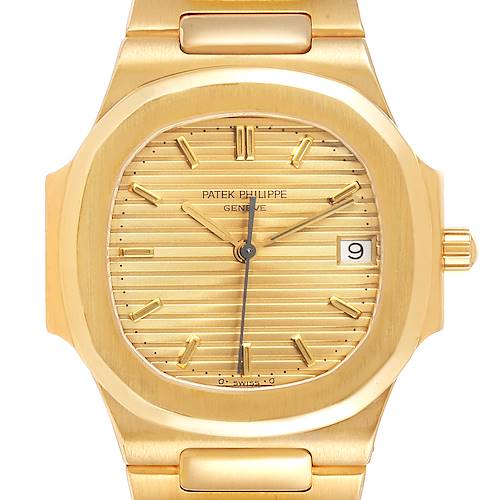 The image shows a close-up view of the dial and bezel of a Patek Philippe Nautilus 3900/1J Women's Yellow Gold Champagne Dial 3900/1J Women's Yellow Gold Champagne Dial watch, highlighting the gold finish and details.
