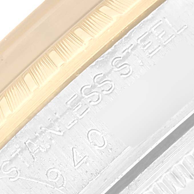 This close-up image shows part of the bezel and the stainless steel case of a Rolex Date 15053 Men's Steel and Gold (two tone) Champagne Dial 15053 Men's Steel and Gold (two tone) Champagne Dial watch.