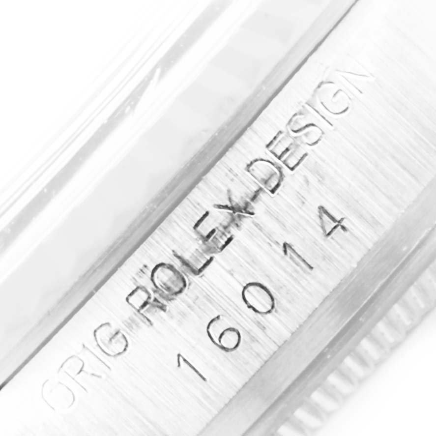 This close-up image of the Rolex Vintage Collection 16014 Men's Stainless Steel Silver Dial 16014 Men's Stainless Steel Silver Dial model shows the engraved text "ORIG ROLEX DESIGN" and "16014".