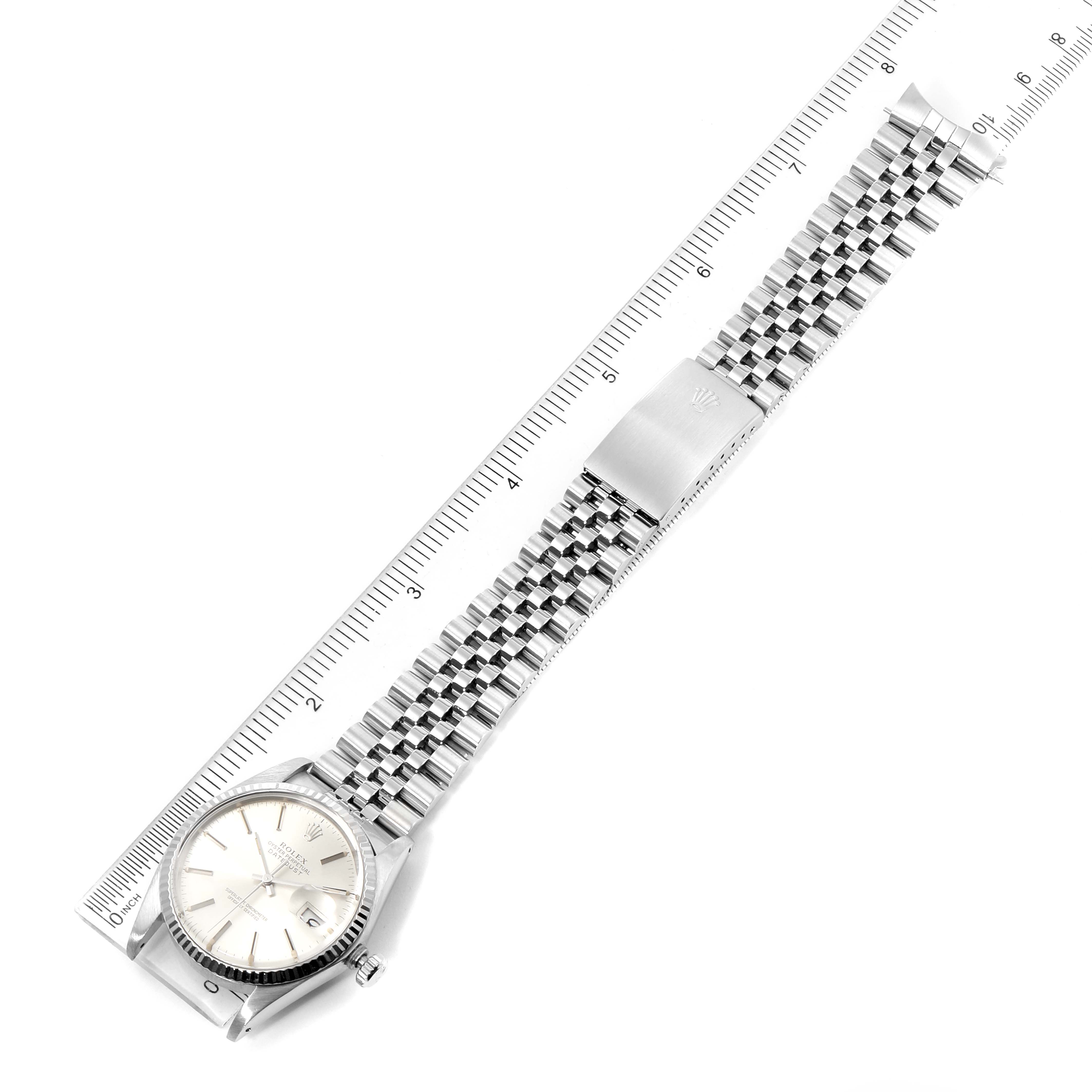 The Rolex Vintage Collection 16014 Men's Stainless Steel Silver Dial 16014 Men's Stainless Steel Silver Dial watch is shown flat with a focus on its dial, band, and clasp, alongside a measurement ruler.
