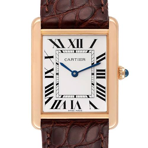 The image shows a front view of the Cartier Tank Solo W5200025 Men's Rose Gold Silver Dial W5200025 Men's Rose Gold Silver Dial watch, highlighting its face, Roman numerals, blue hands, and part of the leather strap.