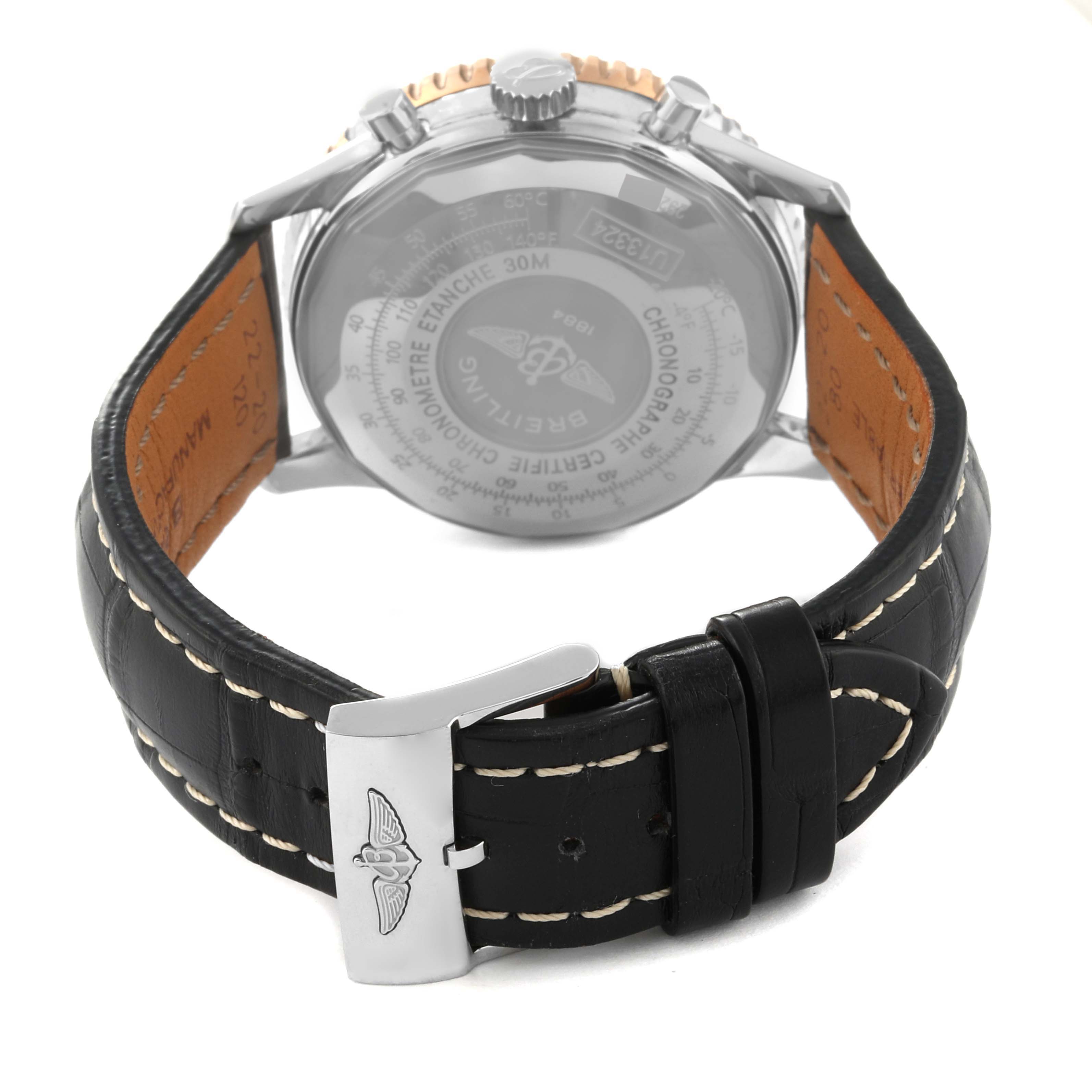 The image shows the back view of a Breitling Navitimer U13324 Men's Steel and Gold (two tone) Black Dial U13324 Men's Steel and Gold (two tone) Black Dial watch, highlighting the black leather strap and clasp.