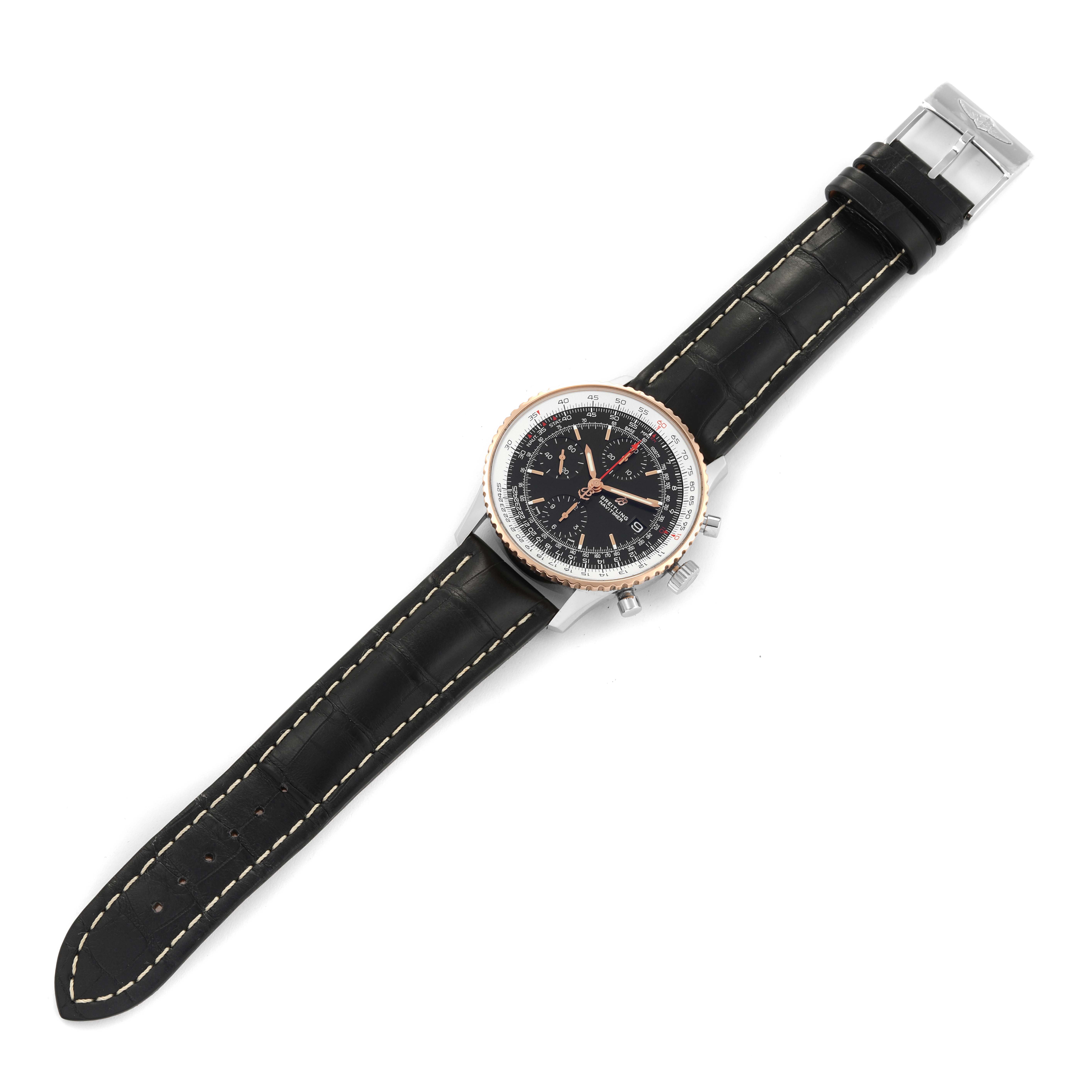 The Breitling Navitimer U13324 Men's Steel and Gold (two tone) Black Dial U13324 Men's Steel and Gold (two tone) Black Dial watch is shown from a top-down angle, displaying the full strap, face, and side buttons.
