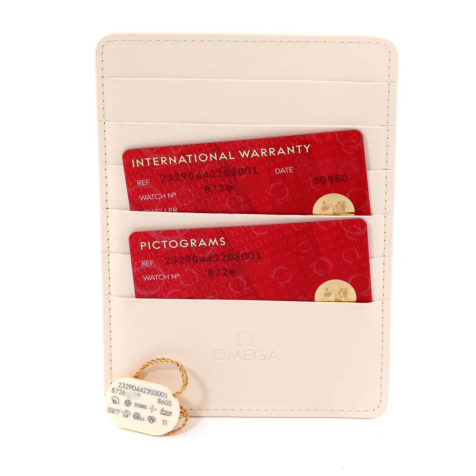 The image shows the international warranty and pictogram cards along with the tag for the Omega Planet Ocean 232.90.44.22.03.001 Men's Titanium Blue Dial 232.90.44.22.03.001 Men's Titanium Blue Dial model, displayed in a cardholder.