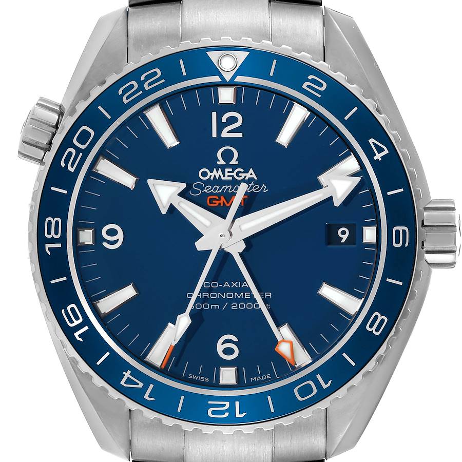 This image shows a close-up of the Omega Planet Ocean 232.90.44.22.03.001 Men's Titanium Blue Dial 232.90.44.22.03.001 Men's Titanium Blue Dial Seamaster GMT watch face, including the bezel, crown, and part of the bracelet.