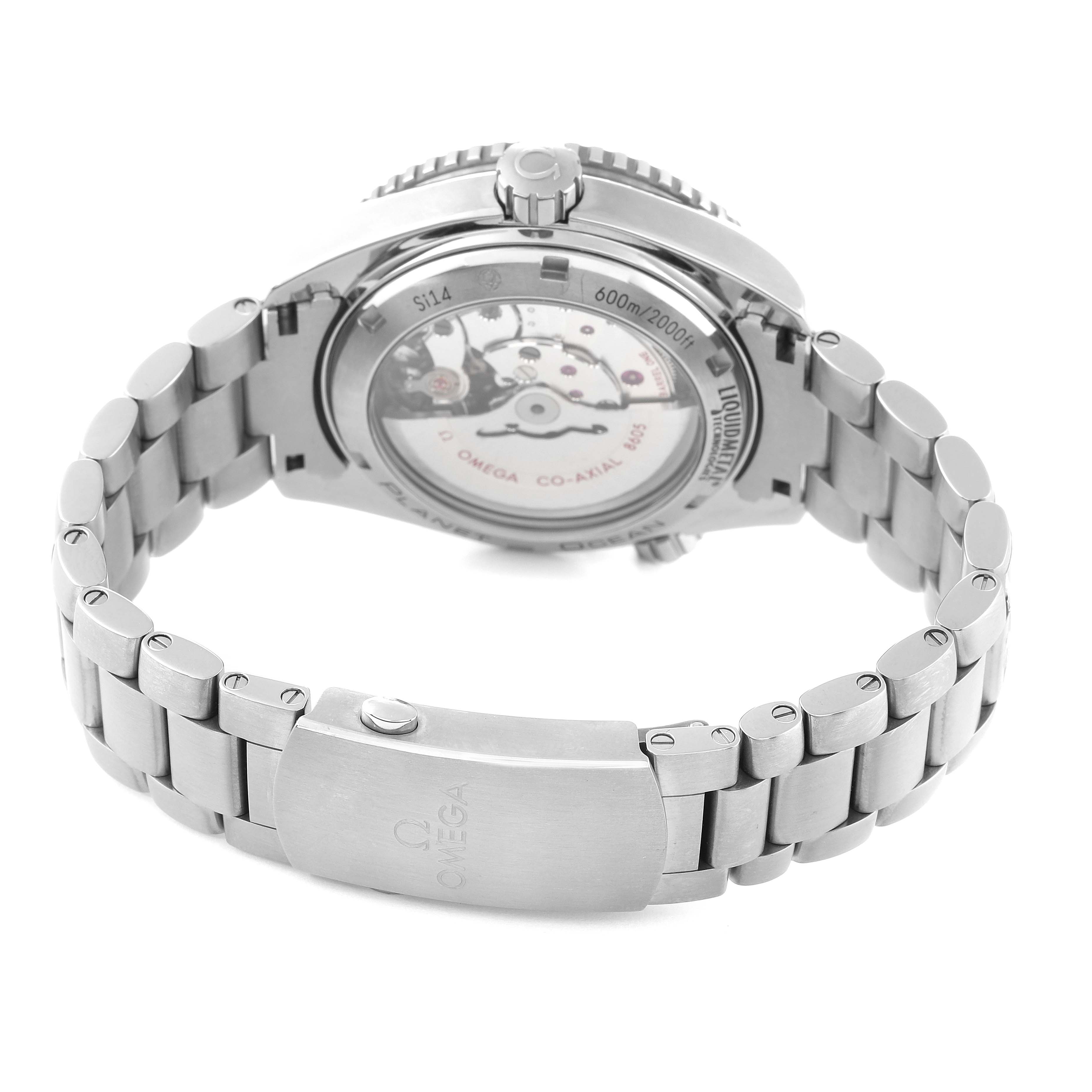 The image shows the back view of the Omega Planet Ocean 232.90.44.22.03.001 Men's Titanium Blue Dial 232.90.44.22.03.001 Men's Titanium Blue Dial watch, highlighting its clasp, bracelet, and transparent case back.