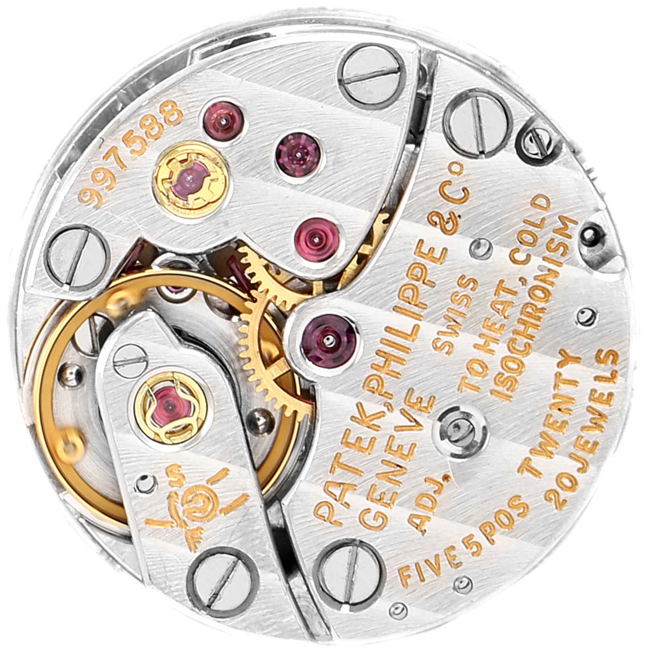 This image shows the intricate internal mechanism of a vintage Patek Philippe watch, highlighting its gears and inscriptions.