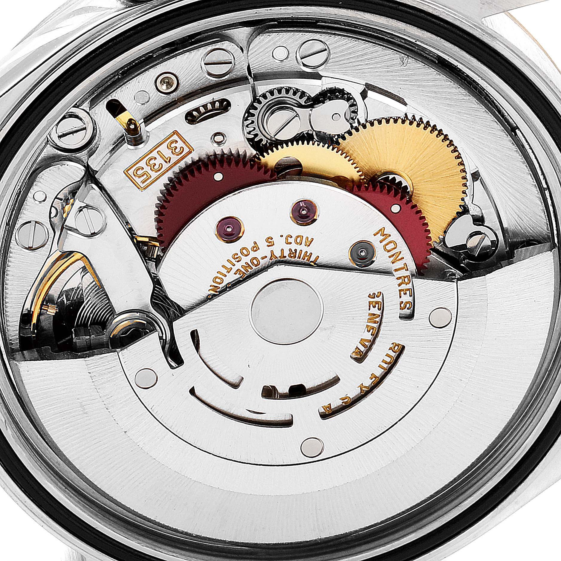 This is the internal mechanism of a Rolex Datejust 16233 Men's Steel and Gold (two tone) Mother of Pearl Dial 16233 Men's Steel and Gold (two tone) Mother of Pearl Dial watch viewed from the back, showing gears and movement components.