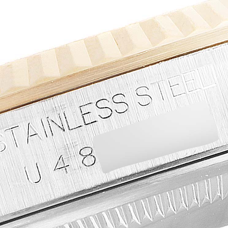 The image shows a close-up of the stainless steel case and the fluted bezel of a Rolex Datejust 16233 Men's Steel and Gold (two tone) Mother of Pearl Dial 16233 Men's Steel and Gold (two tone) Mother of Pearl Dial watch.