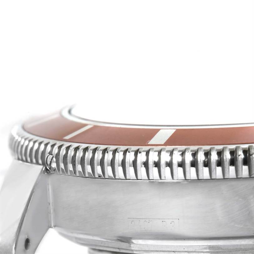 The image shows a close-up side view of the bezel and case of a Breitling Superocean A17320 Men's Stainless Steel Brown Dial A17320 Men's Stainless Steel Brown Dial watch.
