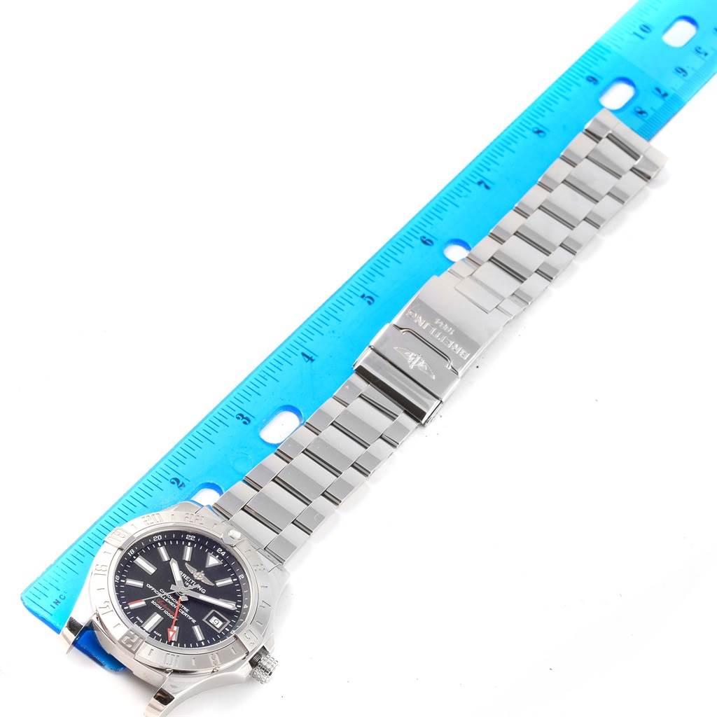 The Breitling Avenger A32390 Men's Stainless Steel Black Dial A32390 Men's Stainless Steel Black Dial watch is shown from a top-down angle, with a ruler for scale, displaying the dial, bezel, and bracelet.