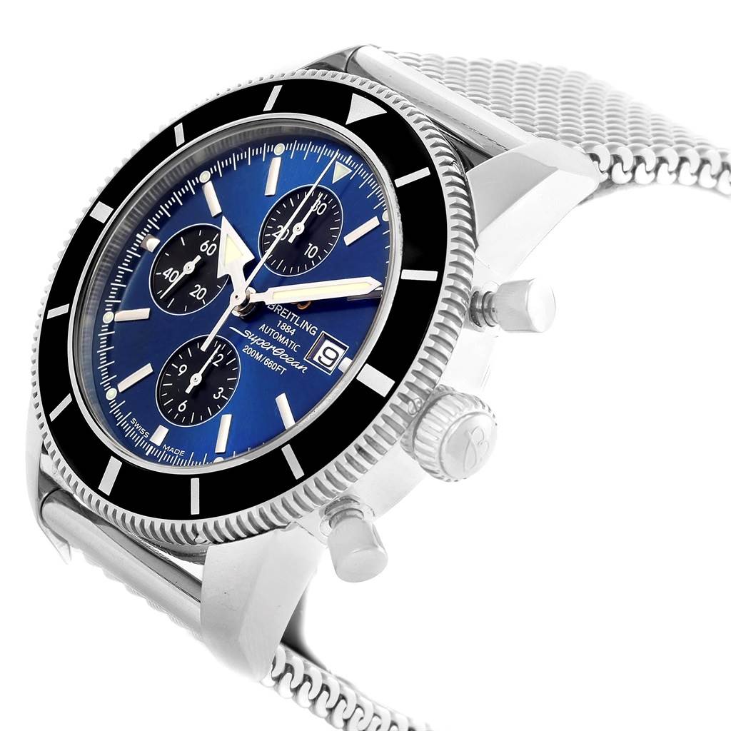 This Breitling Superocean A13320 Men's Stainless Steel Blue Dial A13320 Men's Stainless Steel Blue Dial watch is shown from a side angle, highlighting its bezel, dial, crown, and mesh bracelet.