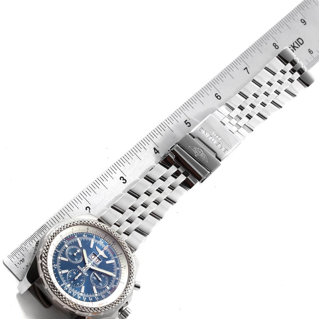 The image shows a Breitling Bentley A44362 Men's Stainless Steel Blue Dial A44362 Men's Stainless Steel Blue Dial watch with a blue dial, metal bracelet, clasp, and a ruler for measurement.