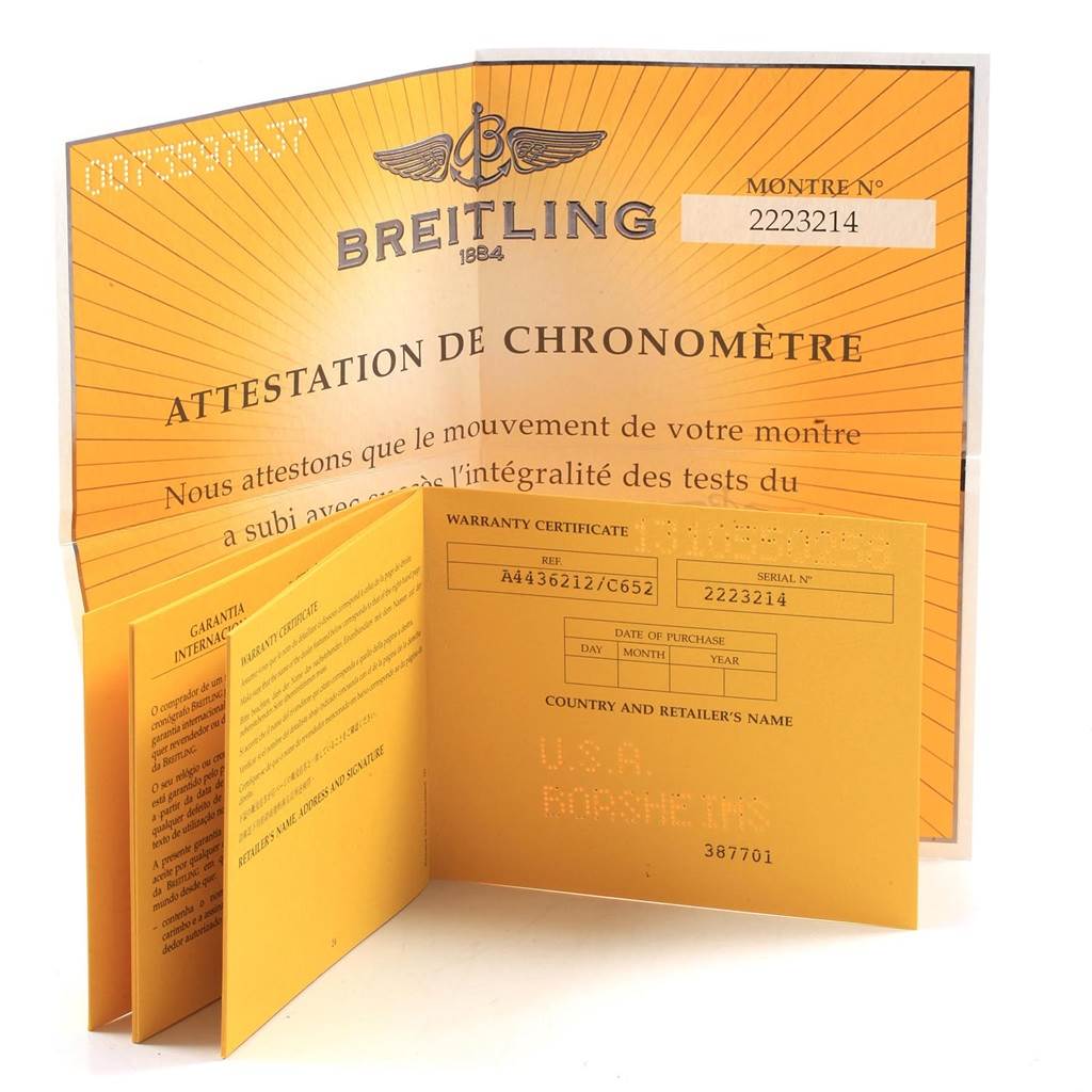 The image shows warranty documents and a chronometer certificate for a Bentley model by Breitling, viewed from above.