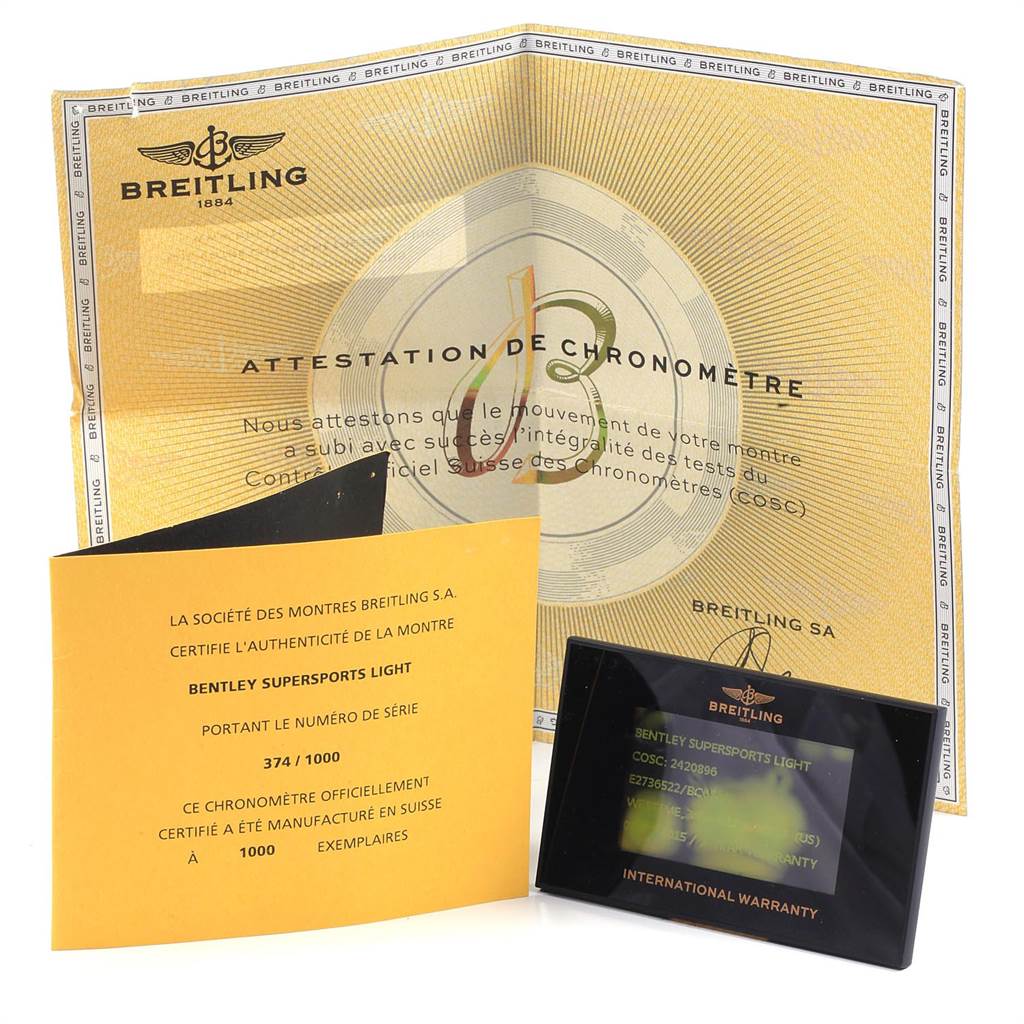 The image shows the warranty cards and certificate papers for the Breitling Bentley E27365 Men's Titanium Black Dial E27365 Men's Titanium Black Dial model at a frontal angle.