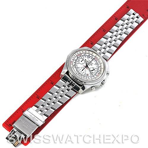 The Breitling Bentley A2536212/G552 Men's Stainless Steel Silver Dial A2536212/G552 Men's Stainless Steel Silver Dial watch is shown from a top-down angle, displaying its face, bezel, and metal bracelet alongside a measuring ruler.