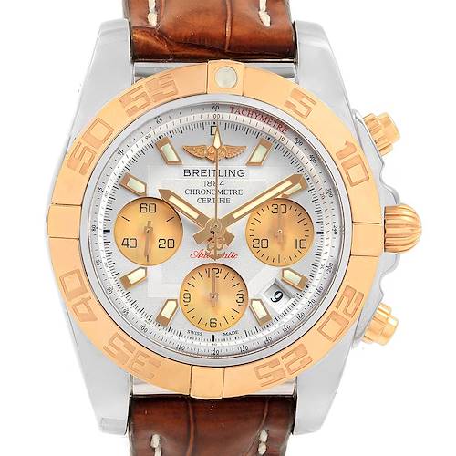 The Breitling Chronomat CB014012 Men's Steel and Gold (two tone) Silver Dial CB014012 Men's Steel and Gold (two tone) Silver Dial watch is shown from a front angle, displaying its dial, bezel, subdials, and leather strap.